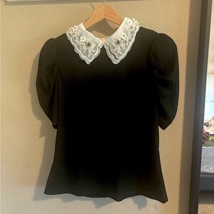 Elegant Black Blouse with White Lace Collar